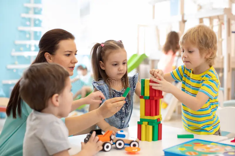 "Children building blocks and learning motor skills"