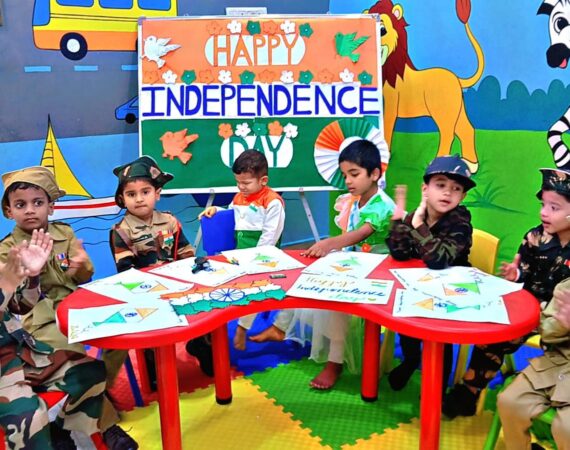 Children in Independence Day costumes doing a craft activity together at Stepping Stone Day Care & Play School